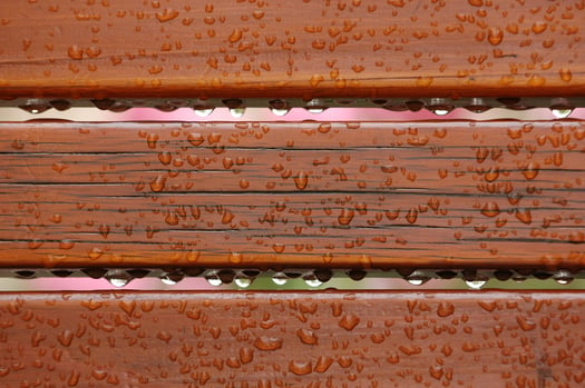 Raindrops on the back of a bench-2